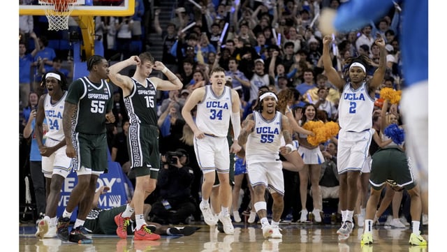 UCLA players celebrate after their 63-61 victory over ninth-ranked Michigan State on Tuesday night at Pauley Pavilion. (AP Photo/Eric Thayer)