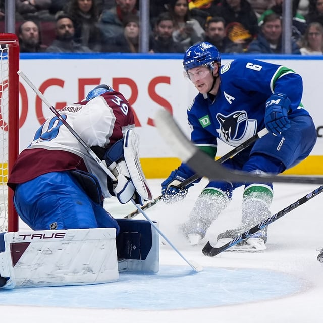Vancouver Canucks' Brock Boeser (6) scores against Colorado Avalanche goalie MacKenzie Blackwood (39) during the third period of an NHL hockey game in Vancouver, on Tuesday, February 4, 2025. THE CANADIAN PRESS/Darryl Dyck