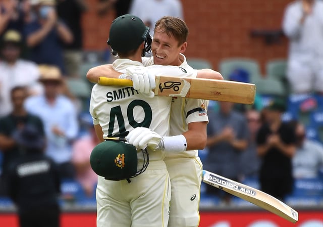 Cricket - Ashes - Second Test - Australia v England - Adelaide Oval, Adelaide, Australia - December 17, 2021 Australia's Marnus Labuschagne reacts after reaching his century with Steven Smith REUTERS/Morgan Sette/File Photo