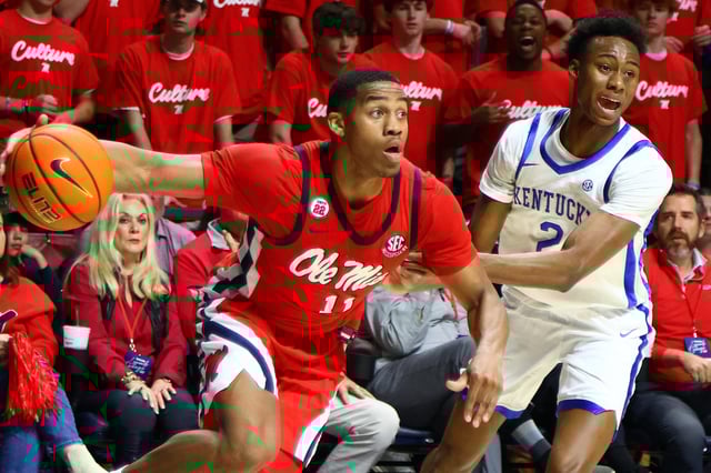 Feb 4, 2025; Oxford, Mississippi, USA; Mississippi Rebels guard Matthew Murrell (11) drives to the basket as Kentucky Wildcats guard Jaxson Robinson (2) defends during the second half at The Sandy and John Black Pavilion at Ole Miss. Mandatory Credit: Petre Thomas-Imagn Images