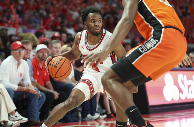 Feb 4, 2025; Houston, Texas, USA; Houston Cougars guard L.J. Cryer (4) controls the ball during the first half against the Oklahoma State Cowboys at Fertitta Center. Mandatory Credit: Troy Taormina-Imagn Images