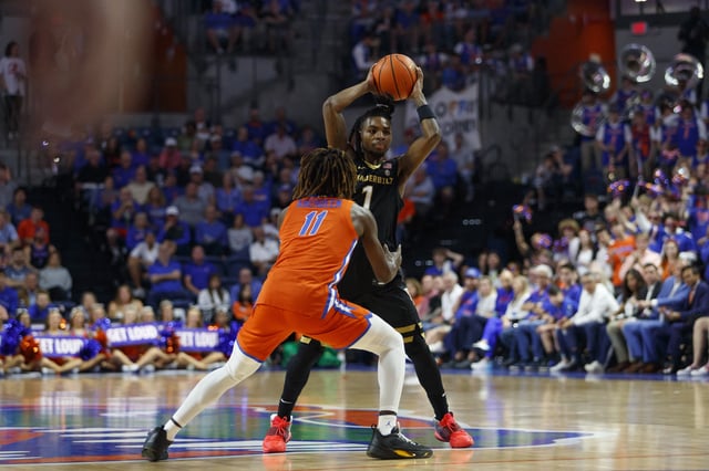 Feb 4, 2025; Gainesville, Florida, USA; Florida Gators guard Denzel Aberdeen (11) guards Vanderbilt Commodores guard Jason Edwards (1) during the first half at Exactech Arena at the Stephen C. O'Connell Center. Mandatory Credit: Morgan Tencza-Imagn Images