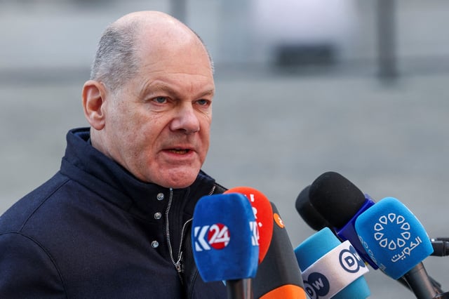 German Chancellor Olaf Scholz speaks to the media on the day of an informal European Union leaders summit at Palais d'Egmont in Brussels, Belgium February 3, 2025. REUTERS/Yves Herman/File Photo