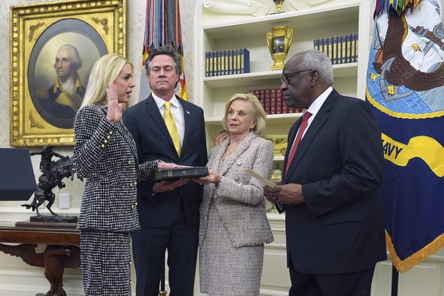 Pam Bondi is sworn in as Attorney General by Supreme Court Associate Justice Clarence Thomas, right, as partner John Wakefield and mother Patsy Bondi, look on, in the Oval Office of the White House, Wednesday, Feb. 5, 2025, in Washington. (AP Photo/Evan Vucci)