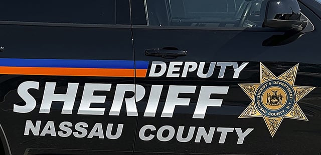 FILE - A Nassau County Deputy Sheriff's vehicle sits parked outside the Nassau Family Court, June 4, 2024, in Westbury, N.Y. (AP Photo/Phil Marcelo, file)