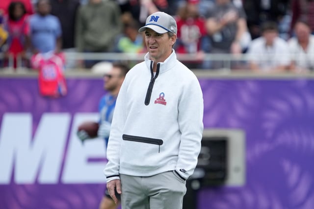 Feb 1, 2025; Orlando, FL, USA; NFC coach Eli Manning throws the ball during Pro Bowl Games practice at Camping World Stadium. Mandatory Credit: Kirby Lee-Imagn Images/File Photo