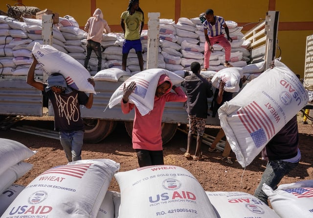 Volunteers deliver a USAID delivery to a camp for internally displaced people in Bahir Dar, Ethiopia on December 17, 2021.