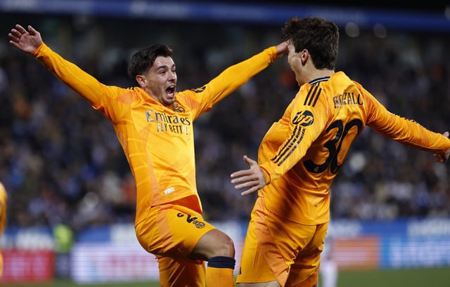Soccer Football - Copa del Rey - Quarter Final - Leganes v Real Madrid - Estadio Municipal de Butarque, Leganes, Spain - February 5, 2025 Real Madrid's Gonzalo Garcia celebrates scoring their third goal with Fran Garcia REUTERS/Juan Medina