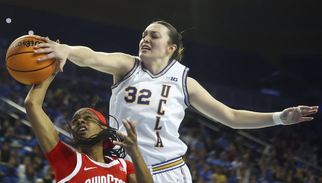UCLA forward Angela Dugalic blocks a shot by Ohio State guard Kennedy Cambridge during the first half of their Big Ten game on Wednesday night at Pauley Pavilion. (AP Photo/Jessie Alcheh)