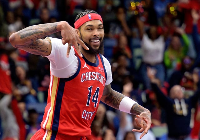 Nov 15, 2024; New Orleans, Louisiana, USA;  New Orleans Pelicans forward Brandon Ingram (14) celebrates a three point basket against the Denver Nuggets during the first half at Smoothie King Center. Mandatory Credit: Matthew Hinton-Imagn Images//FIle Photo