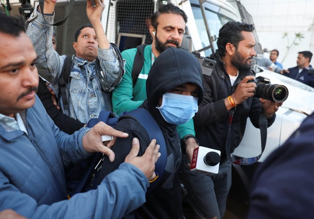 An Indian immigrant deported from the U.S. walks out of the airport in Ahmedabad, India February 6, 2025. REUTERS/Amit Dave
