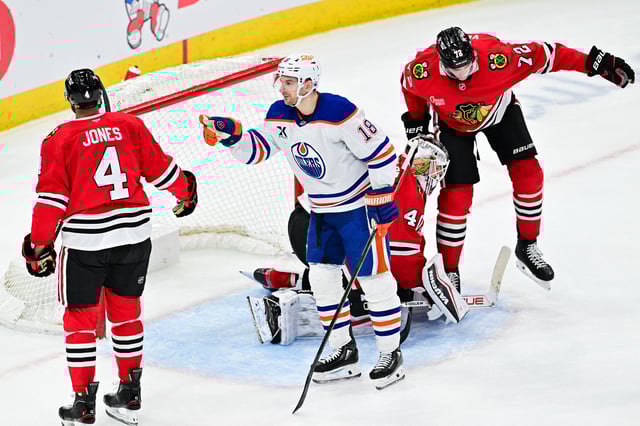 Feb 5, 2025; Chicago, Illinois, USA; Edmonton Oilers center Zach Hyman (18) celebrates his goal against the Chicago Blackhawks during overtime at the United Center. Mandatory Credit: Daniel Bartel-Imagn Images