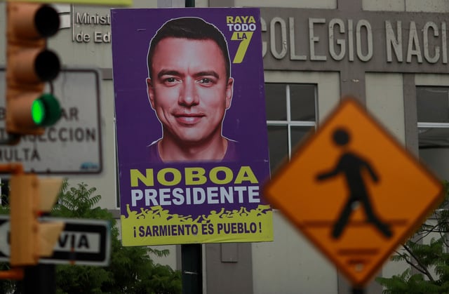 A poster with the image of Ecuador's President and Presidential candidate for re-election, Daniel Noboa, is seen along the street ahead of the presidential election, in Guayaquil, Ecuador, February 4, 2025. REUTERS/Henry Romero/File Photo