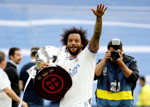 Soccer Football - LaLiga - Real Madrid v Espanyol - Santiago Bernabeu, Madrid, Spain - April 30, 2022 Real Madrid's Marcelo holds the trophy and celebrates after winning LaLiga REUTERS/Juan Medina/File Photo
