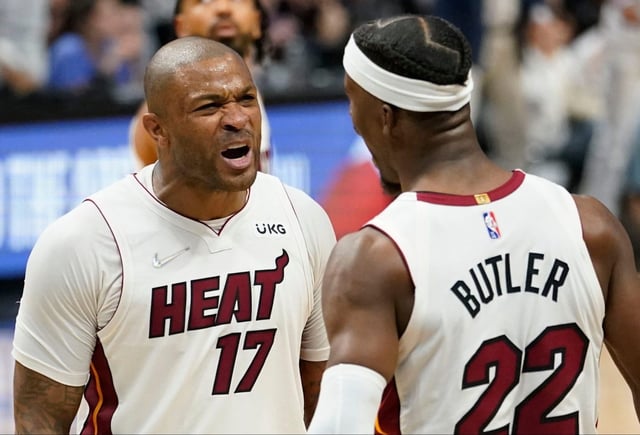 Former Heat forward P.J. Tucker (left) shares a moment with Jimmy Butler during the 2021-22 season. (Sun Sentinel file)