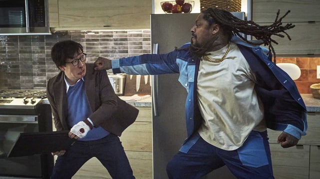 Ke Huy Quan, left, and former Oakland Raiders player Marshawn “Beastmode” Lynch battle in “Love Hurts.”
