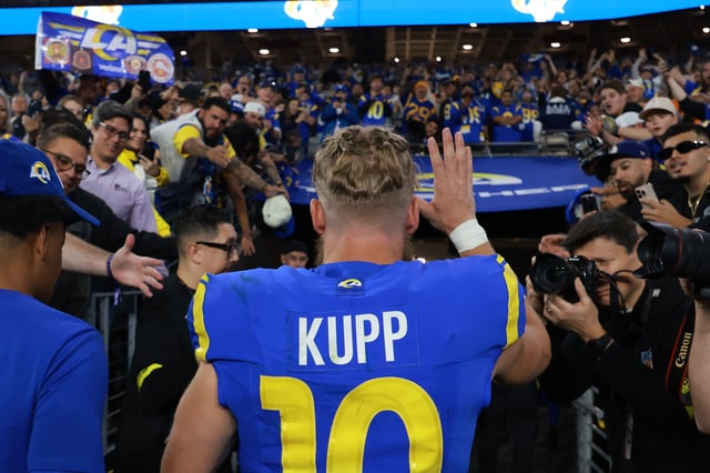 GLENDALE, ARIZONA - JANUARY 13: Cooper Kupp #10 of the Los Angeles Rams celebrates with fans after a win over the Minnesota Vikings during the NFC Wild Card Playoff at State Farm Stadium on January 13, 2025 in Glendale, Arizona.