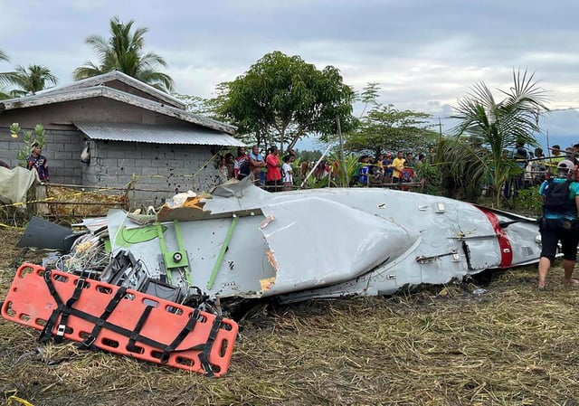 This photo shows the wreckage of airplane in a rice field in Maguindanao del Sur province, Philippines, after officials say a US military-contracted plane crashed in a rice field in the southern Philippines, killing all four people on board, on Thursday, February 6.