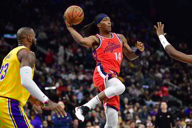 Feb 4, 2025; Inglewood, California, USA; Los Angeles Clippers guard Terance Mann (14) passes the ball against the Los Angeles Lakers during the first half at Intuit Dome. Mandatory Credit: Gary A. Vasquez-Imagn Images/File Photo
