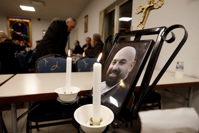 A picture of a mass shooting victim, Salim Iskef, is displayed at St. Mary's church in Orebro, Sweden, February 6, 2025. REUTERS/Kuba Stezycki