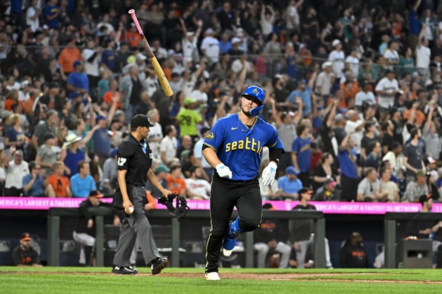 SEATTLE, WASHINGTON - AUGUST 11: Ty France #23 of the Seattle Mariners tosses his bat after hitting a solo home run during the fifth inning against the Baltimore Orioles at T-Mobile Park on August 11, 2023 in Seattle, Washington.
