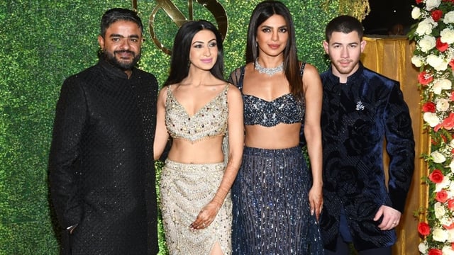 Priyanka Chopra and Nick Jonas posed with Siddharth Chopra and Neelam Upadhyaya at their sangeet ceremony. 