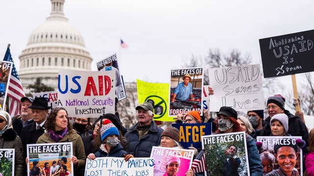 People on Capitol Hill Wednesday protest the Trump administration's move to dismantle USAID. Photo: Demetrius Freeman/The Washington Post via Getty Images