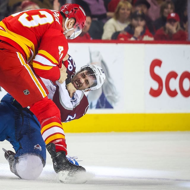Feb 6, 2025; Calgary, Alberta, CAN; Calgary Flames right wing Adam Klapka (43) and Colorado Avalanche left wing Miles Wood (28) fights during the second period at Scotiabank Saddledome. Mandatory Credit: Sergei Belski-Imagn Images