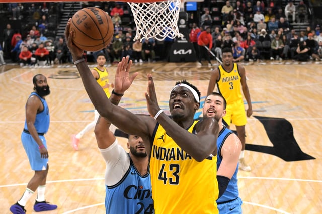 Feb 6, 2025; Inglewood, California, USA;  Indiana Pacers forward Pascal Siakam (43) drives past Los Angeles Clippers center Ivica Zubac (40) and and guard Norman Powell (24) in the second half at Intuit Dome. Mandatory Credit: Jayne Kamin-Oncea-Imagn Images