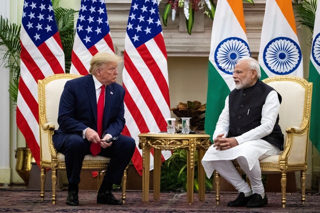 Indian Prime Minister Narendra Modi speaks to U.S. President Donald Trump during a meeting at Hyderabad House in New Delhi, India, February 25, 2020. REUTERS/Al Drago/File Photo