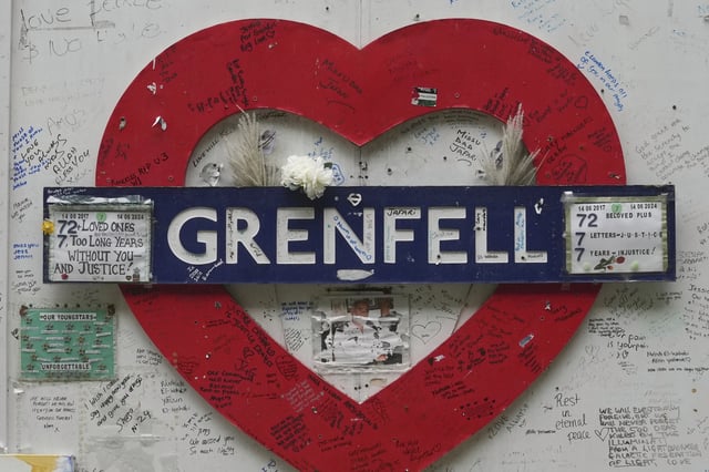 FILE - A detail of the memorial wall next to the Grenfell Tower in London, Sept. 2, 2024, after a fire in June 2017 where 72 people were killed. (AP Photo/Kin Cheung, File)