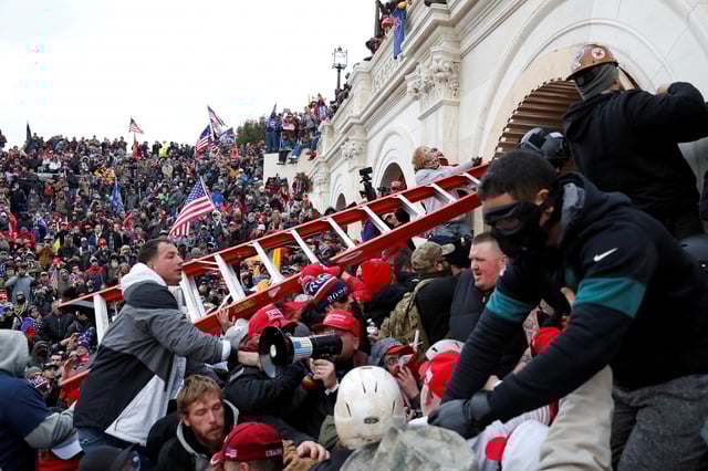Pro-Trump protesters storm into the U.S. Capitol during clashes with police, during a rally to contest the certification of the 2020 U.S. presidential election results by the U.S. Congress, in Washington, U.S, January 6, 2021. REUTERS/Shannon Stapleton/File Photo
