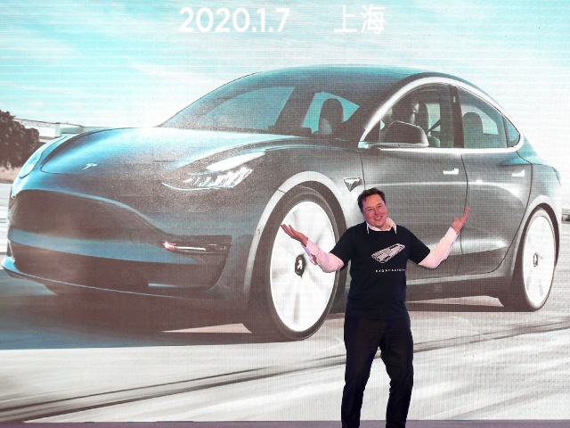 Tesla CEO Elon Musk gestures during the Tesla China-made Model 3 Delivery Ceremony in Shanghai. Tesla CEO Elon Musk presented the first batch of made-in-China cars to ordinary buyers on January 7, 2020 in a milestone for the company's new Shanghai "giga-factory", but which comes as sales decelerate in the world's largest electric-vehicle market. (Photo by AFP) / China OUT