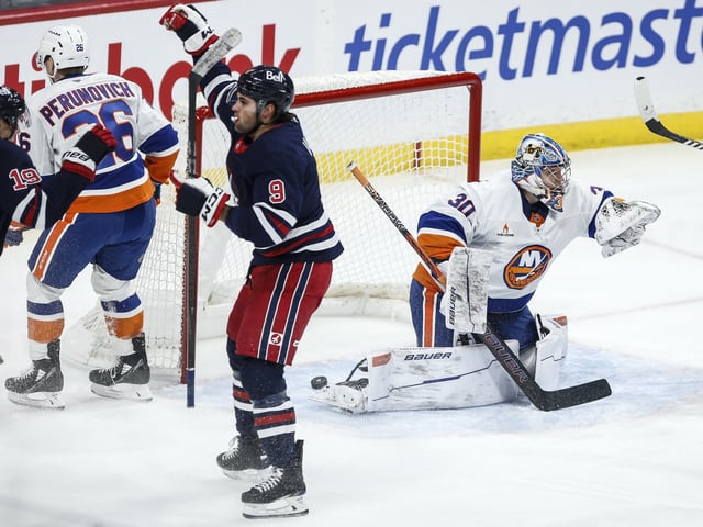Winnipeg Jets' Alex Iafallo (9) celebrates his goal on New York Islanders goaltender Ilya Sorokin (30) during first period NHL action in Winnipeg on Friday, February 7, 2025. THE CANADIAN PRESS/John Woods