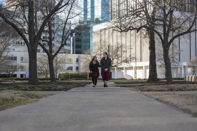 Lisa Suhay, left, walks with her daughter Mellow, who is transgender, Monday, Feb. 3, 2025, in Norfolk, Va. (AP Photo/Stephanie Scarbrough)