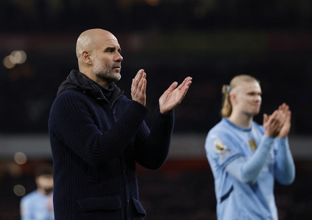 Soccer Football - Premier League - Arsenal v Manchester City - Emirates Stadium, London, Britain - February 2, 2025 Manchester City manager Pep Guardiola and Erling Haaland applaud fans after the match Action Images via Reuters/Peter Cziborra/File Photo