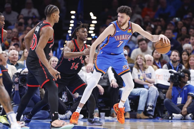 Feb 7, 2025; Oklahoma City, Oklahoma, USA; Oklahoma City Thunder forward Chet Holmgren (7) moves the ball against Toronto Raptors guard JaKobe Walter (14) during the second half at Paycom Center. Mandatory Credit: Alonzo Adams-Imagn Images