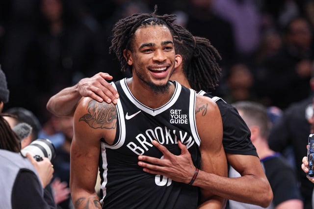 Feb 7, 2025; Brooklyn, New York, USA; Brooklyn Nets center Nic Claxton (33) celebrates with teammates after defeating the Miami Heat at Barclays Center. Mandatory Credit: Vincent Carchietta-Imagn Images