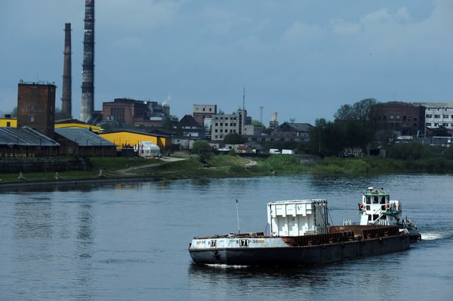 A barge with autotransformer intended for the expansion of the Lithuanian-Polish electricity system connection LitPol Link, moves past the Russian town of Sovetsk, as seen from Panemune, Lithuania May 14, 2021 REUTERS/Ints Kalnins/File Photo