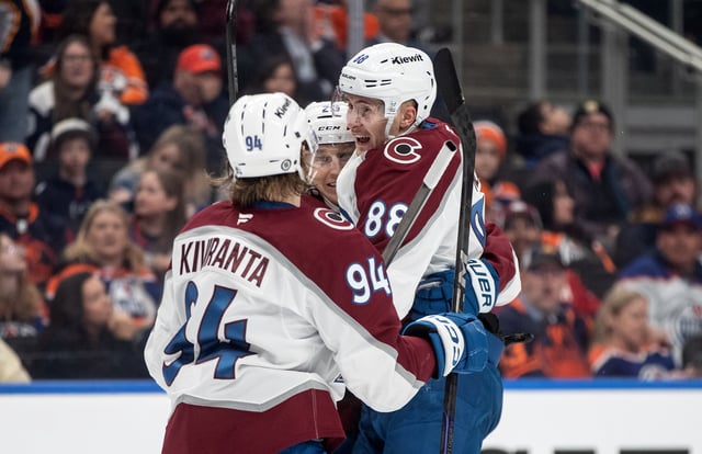 Colorado Avalanche's Joel Kiviranta (94), Nathan MacKinnon (29) and Martin Necas (88) celebrate a goal against the Edmonton Oilers during third period NHL action in Edmonton on Friday, February 7, 2025.