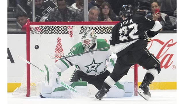 Kings left wing Kevin Fiala, right, scores on Dallas Stars goaltender Jake Oettinger during a shootout on Friday night at Crypto.com Arena. The Kings won, 5-4. (AP Photo/Mark J. Terrill)