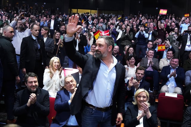 Spanish far-right VOX party leader Santiago Abascal, centre, waves next to European far-right politicians during the Patriots for Europe summit in Madrid, Spain, Saturday, Feb. 8, 2025. From left, Italy's vice Premier Matteo Salvini, Hungarian Prime Minister Viktor Orban, far-right VOX party leader Santiago Abascal and French far-right leader Marine Le Pen. (AP Photo/Paul White)