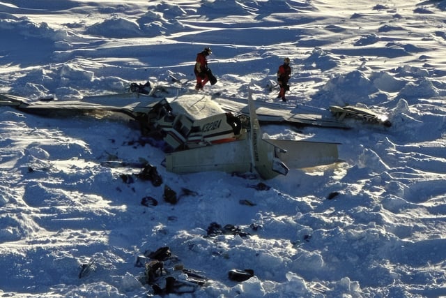 This photo provided by the U.S. Coast Guard on Friday, Feb. 7, 2025, shows a small commuter plane that crashed in western Alaska on a flight that was bound for the hub community of Nome.