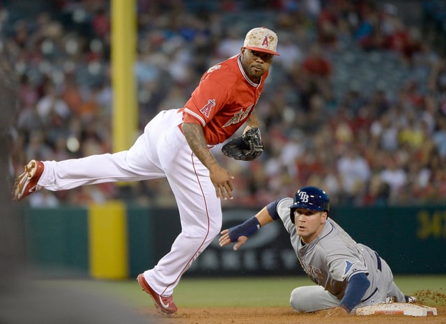 Howie Kendrick #47 of the Los Angeles Angels turns a double play in front of Kevin Kiermaier #39 of the Tampa Bay Rays during the fifth inning at Angel Stadium of Anaheim on May 17, 2014 in Anaheim.