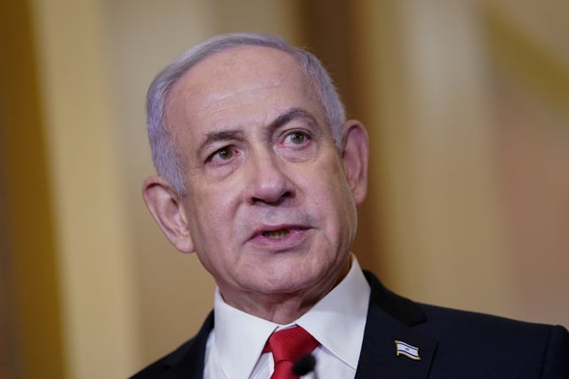 Israeli Prime Minister Benjamin Netanyahu speaks to reporters next to the U.S. house speaker at the U.S. Capitol in Washington, U.S., February 7, 2025. REUTERS/Nathan Howard/File Photo