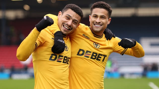 Andre and goalscorer Gomes celebrate victory for Wolves at Ewood Park