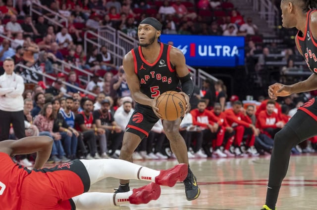 Toronto Raptors guard Immanuel Quickley (5) sets up to take a shot in the first half of an NBA basketball game against Houston Sunday, Feb. 9, 2025 at the Toyota Center in Houston.