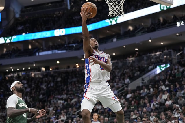 Feb 9, 2025; Milwaukee, Wisconsin, USA;  Philadelphia 76ers guard Tyrese Maxey (0) shoots during the second quarter against the Milwaukee Bucks at Fiserv Forum. Mandatory Credit: Jeff Hanisch-Imagn Images