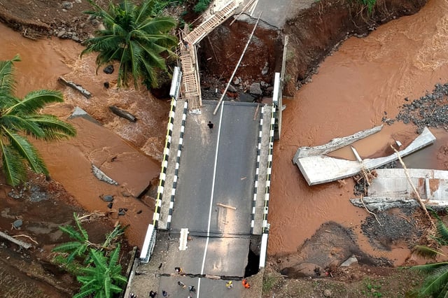 An aerial view of a bridge damaged by floods in West Java province, Indonesia in December 2024. Credit: Rangga Firmansyah / Alamy Stock Photo