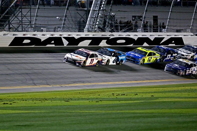 Denny Hamlin (11) leads the field on the last lap of the 2020 Daytona 500 at Daytona International Speedway.